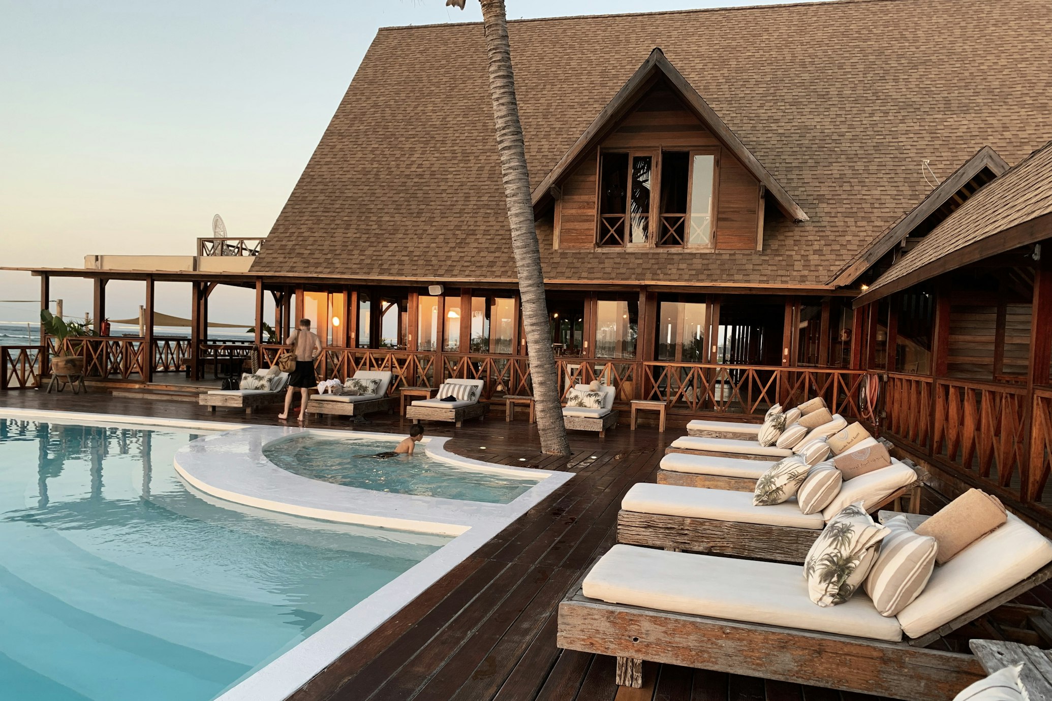 Resort exterior with pool and lounge deck